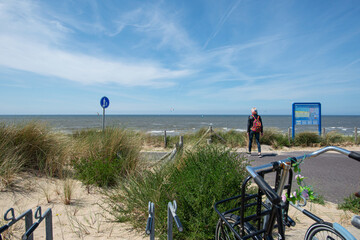 empty sandy beach. kite surfers on the water of North Sea, Zandvoort, Netherlands