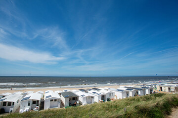 empty sandy beach. kite surfers on the water of North Sea, Zandvoort, Netherlands