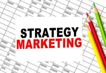 Text STRATEGY MARKETING on financial tables, the working paper . Business and financial conzept.