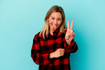 Young mixed race woman isolated on blue background showing number two with fingers.