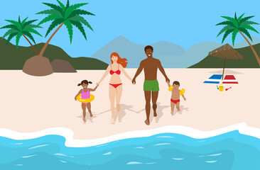 Obraz na płótnie Canvas Young happy family on vacation at the beach