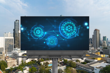 Technology hologram on billboard over panorama city view of Bangkok. The largest tech hub in...
