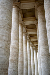 the beautiful walkway of stone pillars surrounding the Vatican building in Rome, Italy
