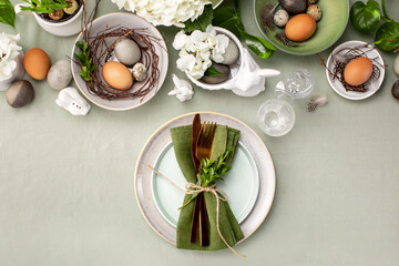 Easter table setting with traditional Easter home decor and tableware