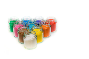Jars with pigments arranged in a triangular shape