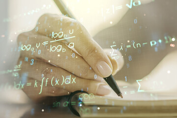 Creative scientific formula illustration with woman hand writing in diary on background, science and research concept. Multiexposure