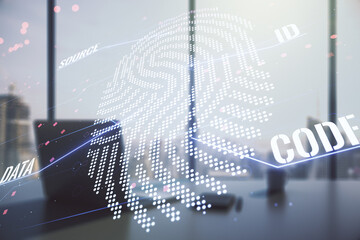 Multi exposure of creative fingerprint hologram and modern desktop with laptop on background, personal biometric data concept