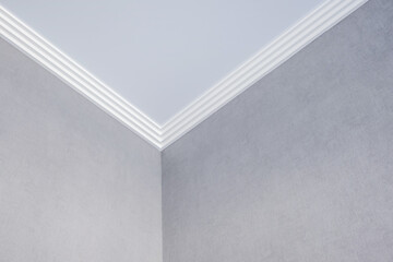 Detail of corner ceiling cornice with intricate crown molding. © hiv360