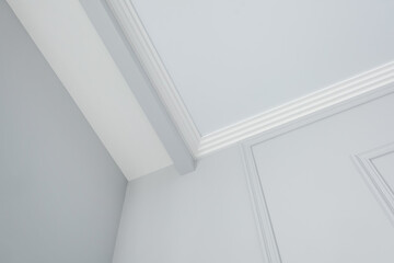 Detail of corner ceiling cornice with intricate crown molding.