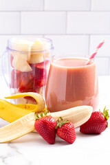 Strawberry Banana Smoothie on a Bright White Kitchen Cabinet