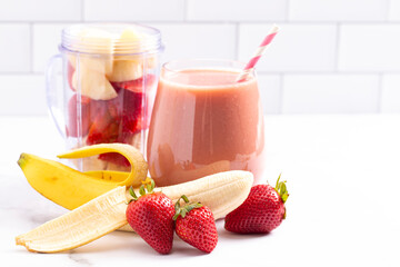 Strawberry Banana Smoothie on a Bright White Kitchen Cabinet