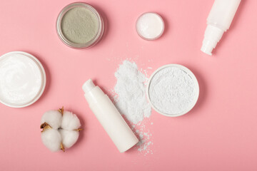 Altate and clay face masks. Cosmetic products, masks and creams in buns. Top view, flat lay