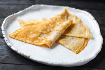 crepes sweet dessert thin pancakes flat cake Shrovetide snack healthy meal top view copy space for text food background rustic