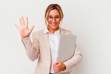 Young caucasian business woman holding a laptop isolated on white background smiling cheerful...