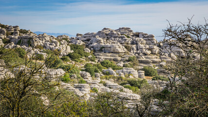 Fototapeta na wymiar Hiking the Torcal de Antequerra National Park in Andalusia, Spain. This national is known for its unusual karst landforms, made of limestone