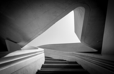 Modern architecture and empty staircase leading to a bright open space. - obrazy, fototapety, plakaty