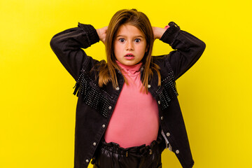 Little caucasian girl isolated on yellow background celebrating a victory or success, he is...