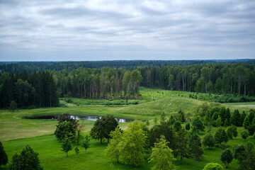 green meadow with storm clouds moving on
