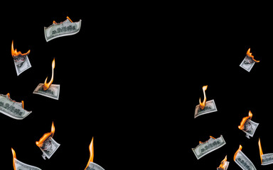 Several 100 dollar bills, falling down, burn on a black background. The concept of bankruptcy,...