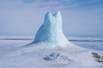 frozen geyser, frozen fountain, ice volcano or ice mountain in Kazakhstan