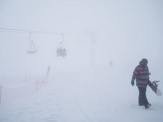 Vasilitsa ski resort with people in a cloudy day