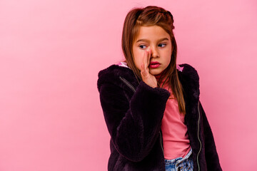 Little caucasian girl isolated on pink background