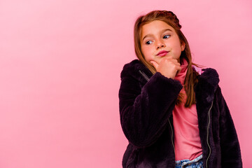 Little caucasian girl isolated on pink background