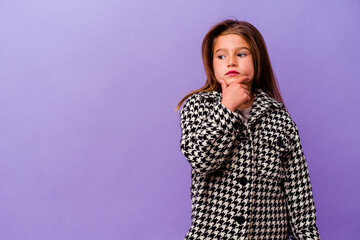 Little caucasian girl isolated on purple background Little caucasian girl isolated on purple...
