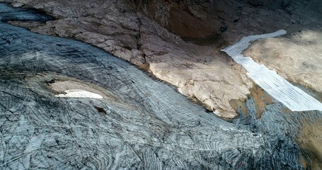 The Marmolada glacier in summer: Aerial view of the last and the only glacier of the Dolomites, UNESCO heritage, near the town of Canazei - August 2018 - Evidence of global warming and melting glacier
