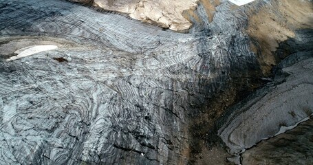 The Marmolada glacier in summer: Aerial view of the last and the only glacier of the Dolomites, UNESCO heritage, near the town of Canazei - August 2018 - Evidence of global warming and melting glacier