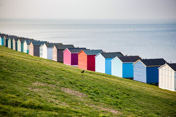 row of beach huts in Tankerton near Whitstable in Kent - British summer