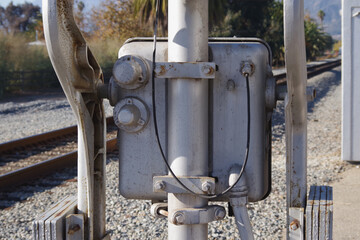 Close-up view of a part of a railroad crossing signal with an automatic barrier
