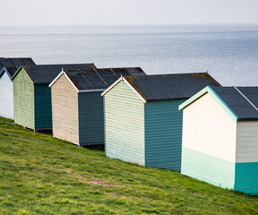 row of beach huts in Tankerton near Whitstable in Kent - British summer