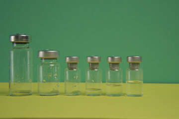 empty medical vials with medicine leftovers close up