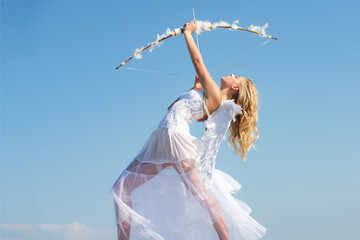 Sexy angel girl with white wings. Cupid bow and arrow. Sweet angelic woman. Valentines day.