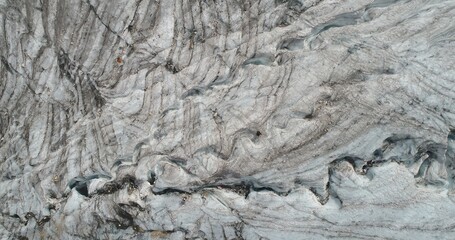 The Marmolada glacier in summer: Aerial view of the last and the only glacier of the Dolomites, UNESCO heritage, near the town of Canazei - August 2018 - Evidence of global warming and melting glacier