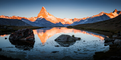 Famous peak Matterhorn (Cervino) in red sunlight. Location place Stellisee, Switzerland, Swiss alps, Europe.