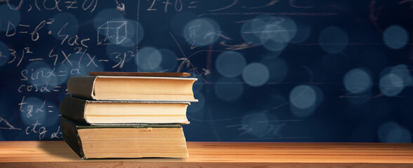 pencil on book on math chalkboard - obrazy, fototapety, plakaty