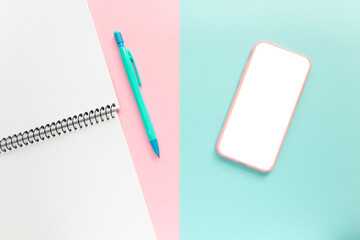 mobile phone with notebook on workspace. Office background
