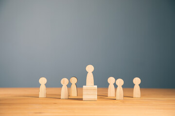 Teamwork and organization with wooden figures