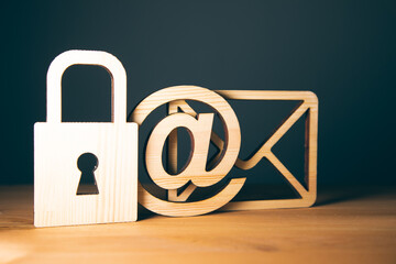 wooden letter with email and lock signs
