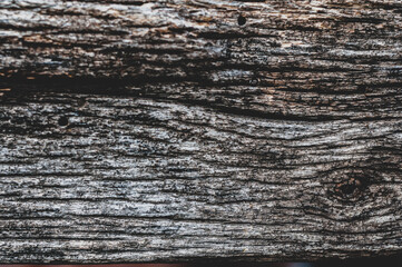 Fototapeta premium Very old cracked wood plank, vintage wood background close-up, rough textured surface