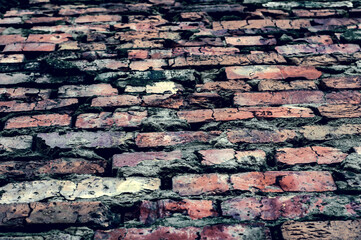 Grungy background. Texture from old red brick mesh, vintage surface, bottom up view,