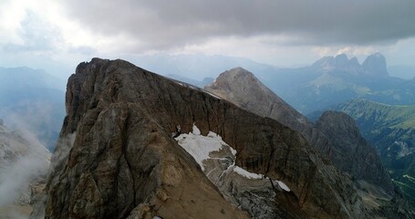 The Marmolada glacier in summer: Aerial view of the last and the only glacier of the Dolomites, UNESCO heritage, near the town of Canazei - August 2018 - Evidence of global warming and melting glacier