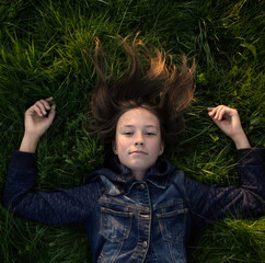 teenager lying on the grass
