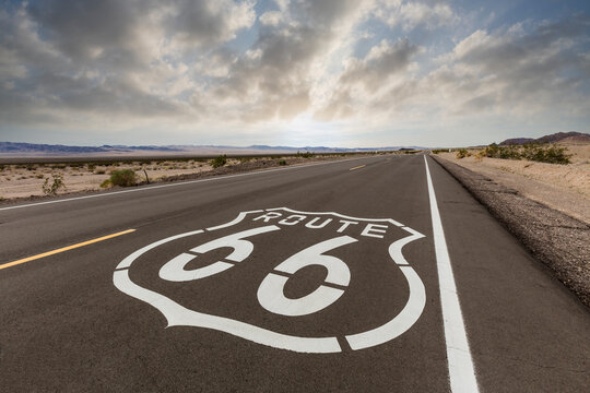 Route 66 highway sign with dawn sky near Amboy in the California Mojave desert.  
