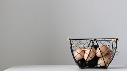 Fototapeta na wymiar easter egg in the metal basket