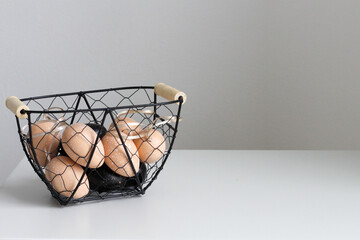 Fototapeta na wymiar easter egg in the metal basket