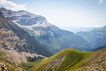 Majestic mountain surrounded by green meadows in summer