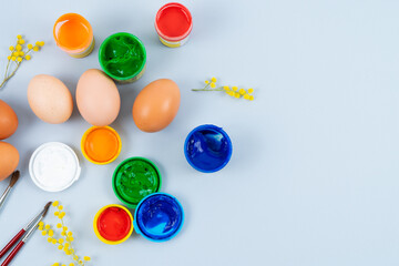 Eggs and paints. Easter eggs decoration process.
